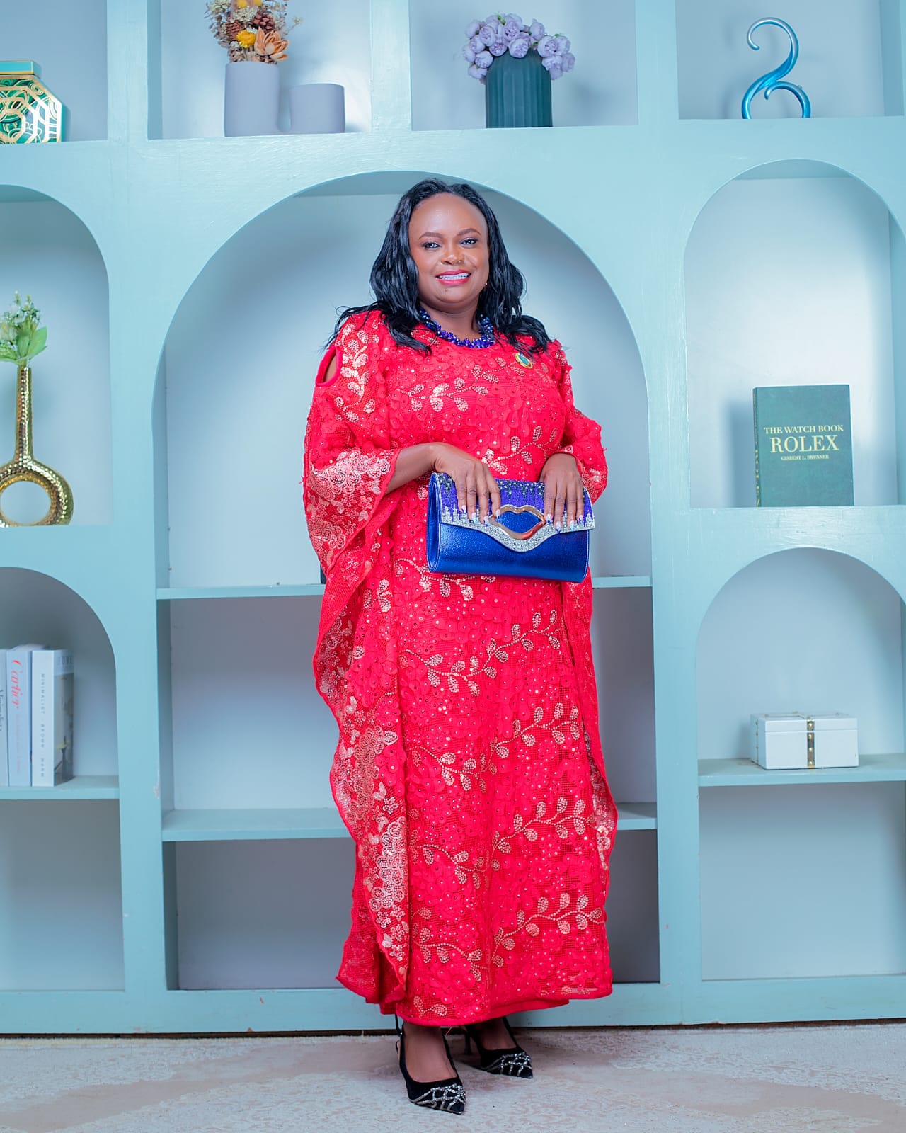 Jennifer Kianga standing in a red gown